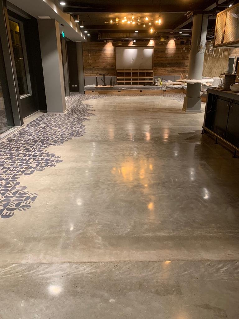 Commercial polished concrete restaurant floor with tile inlay